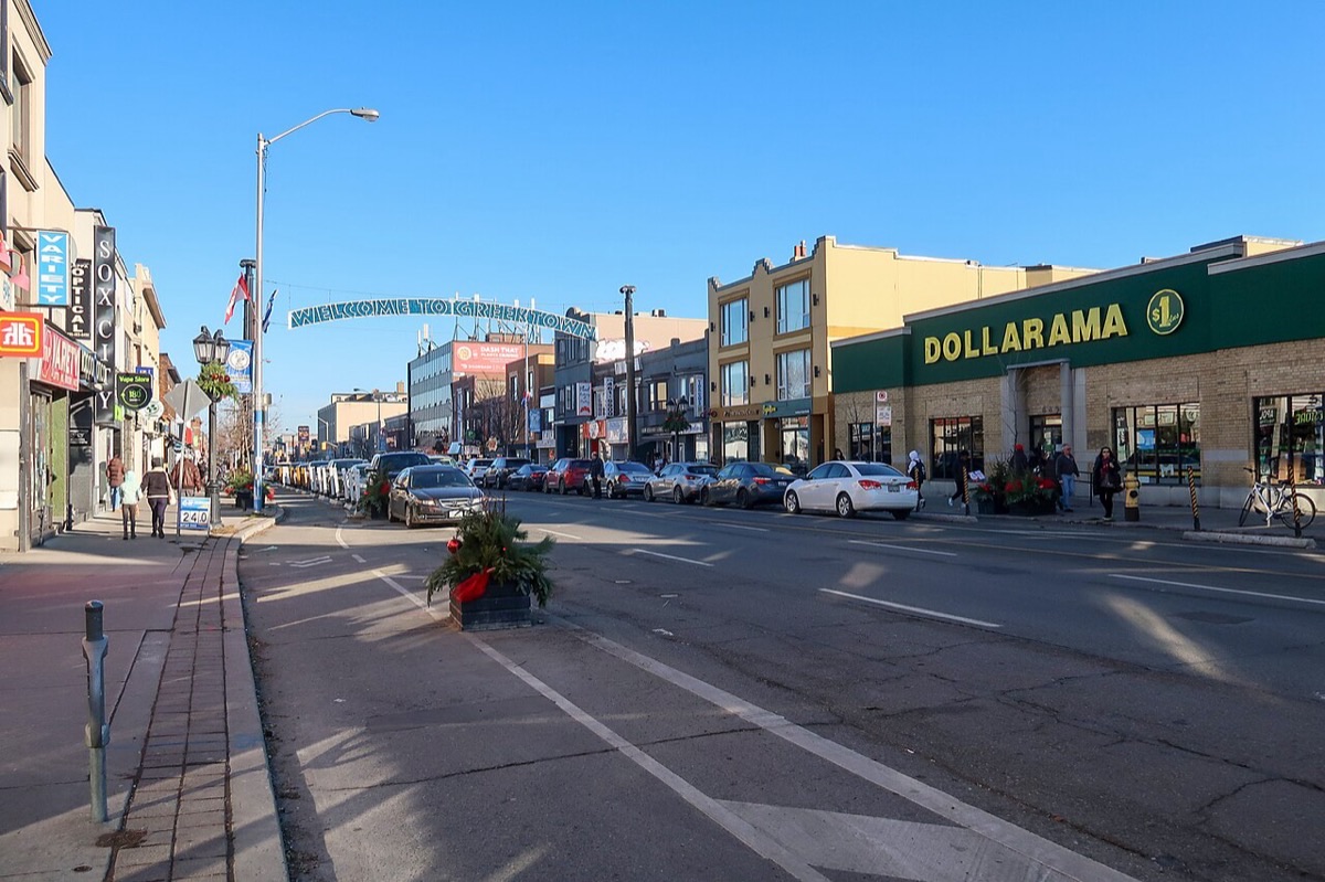 Danforth Avenue in Greektown, East York, with the Welcome to Greektown banner over the street.